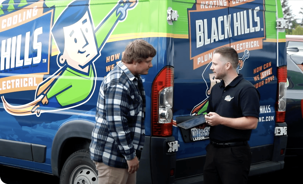 Areas We Serve 1 Black Hills Employees Talking Near Van