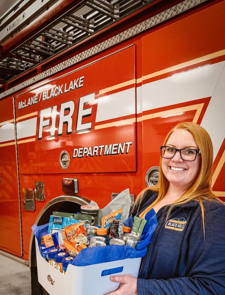 Black Hills staff delivering snack basket